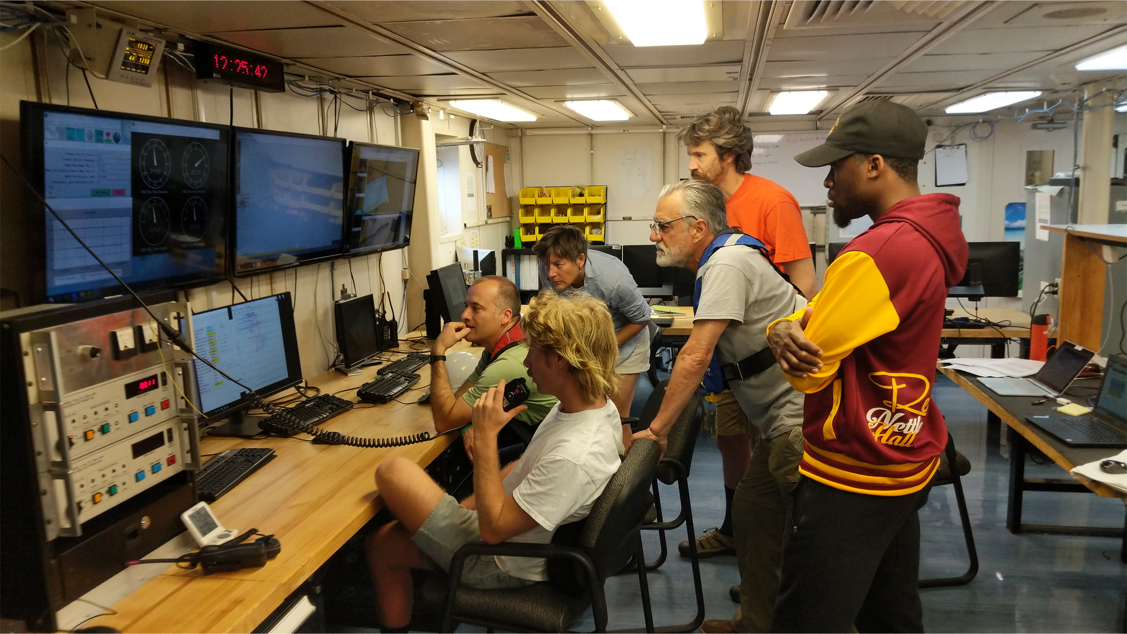 Science team members monitor the display information as the CTD rosette makes its way down to a depth of 2,000 meters. 