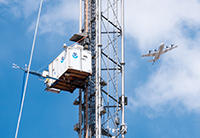 A P3 Orion aircraft flies by the tower during the DISCOVER-AQ experiment. Credit: Will von Dauster, NOAA