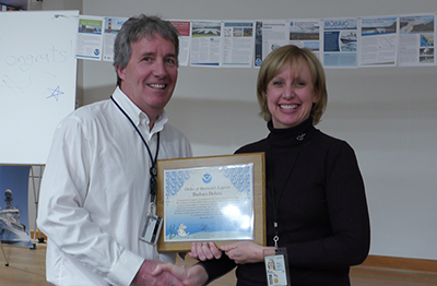 PSL Director Robert Webb presents NOAA Silver Sherman Award to Barb DeLuisi