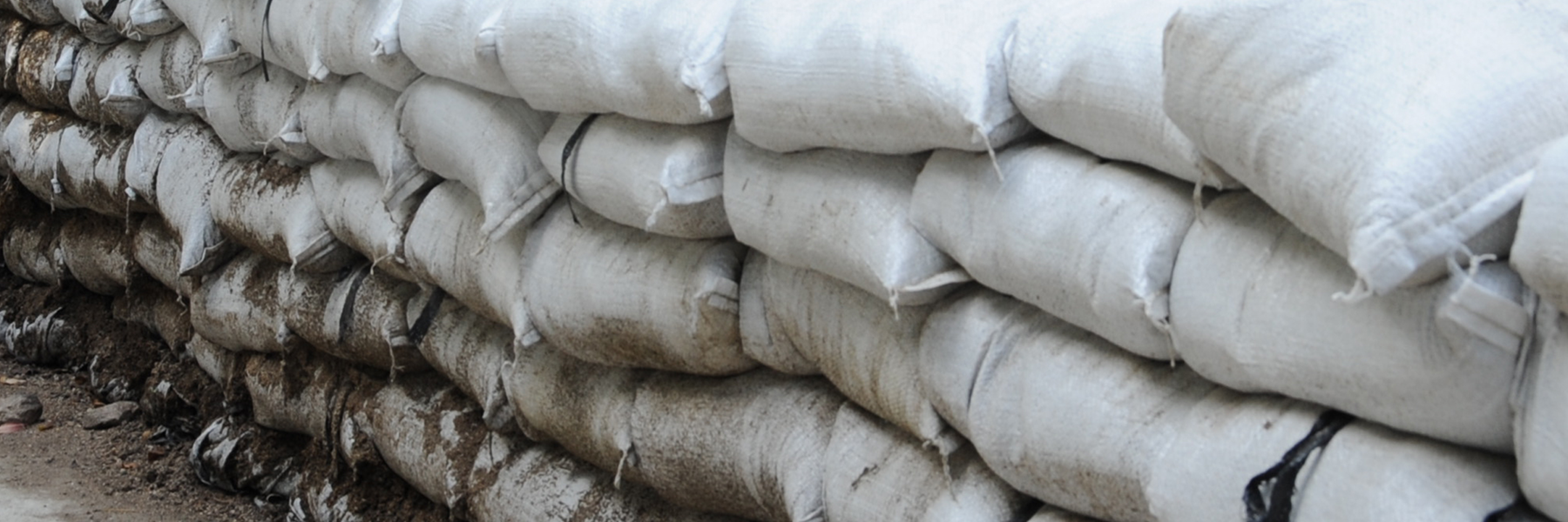 Photo of sandbags.Flood damages can be mitigated by early warning and protective measures.