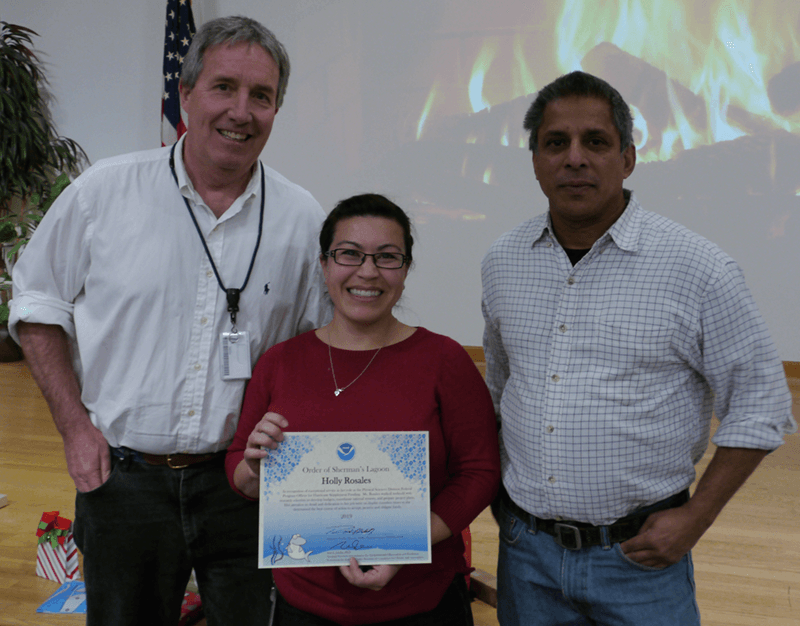 PSL Director Robert Webb (left) presents Holly Rosales the NOAA Silver Sherman Award, with Senior Scientist Roger Pulwarty (right).