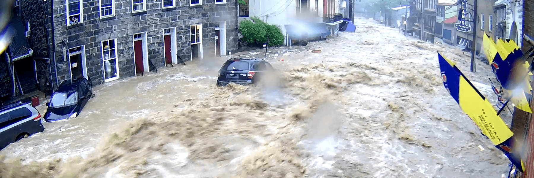 A flooded street during the Ellicott City, MD event. Webcam image provided courtesy Ellicott City Unilux Camera Network/Ron Peters